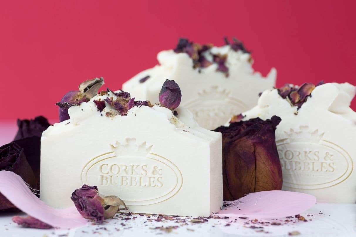 Amazing Grace soap bars topped with rose petals